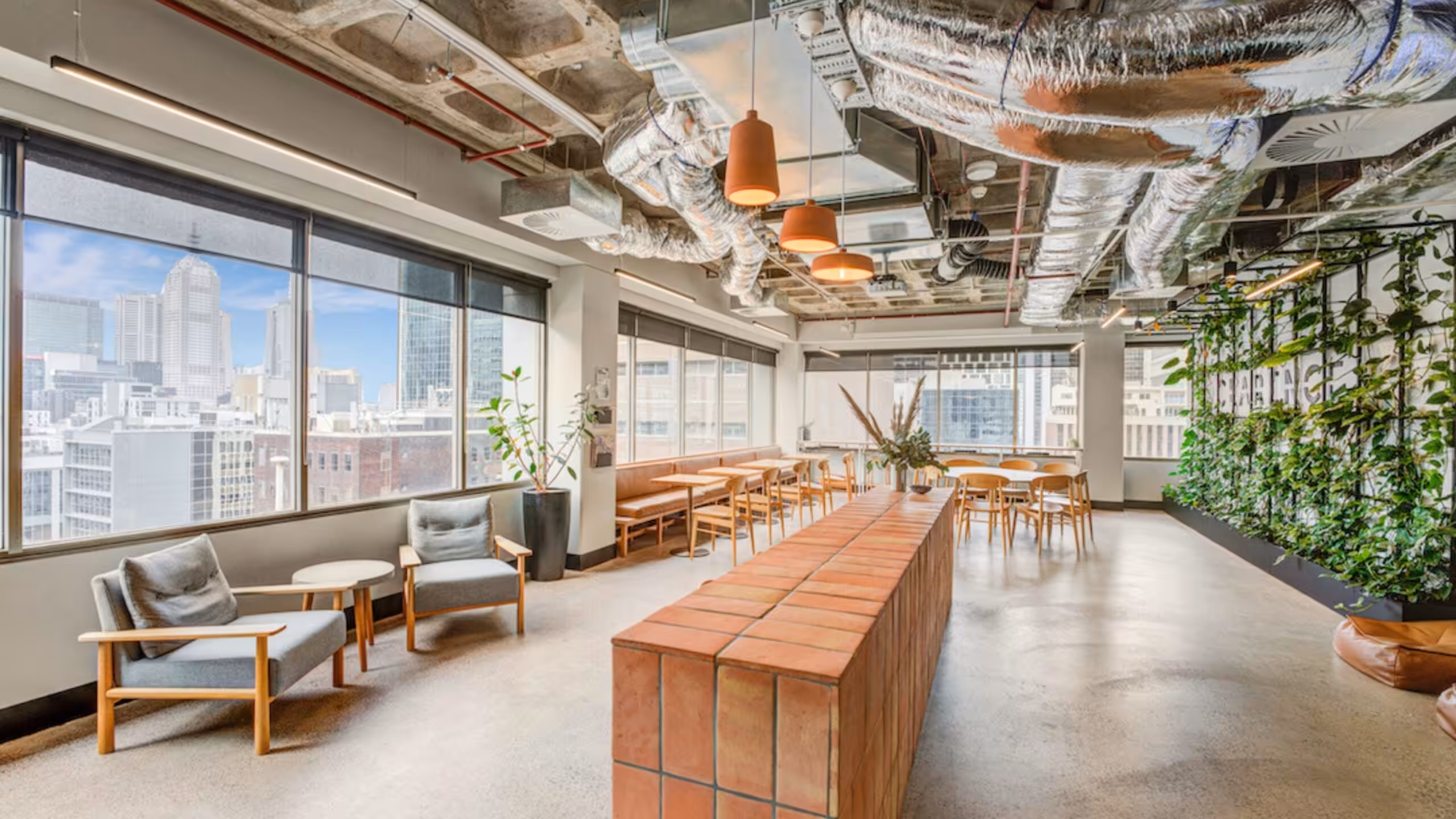 The member lounge at Clarence, with planting and a wide city outlook