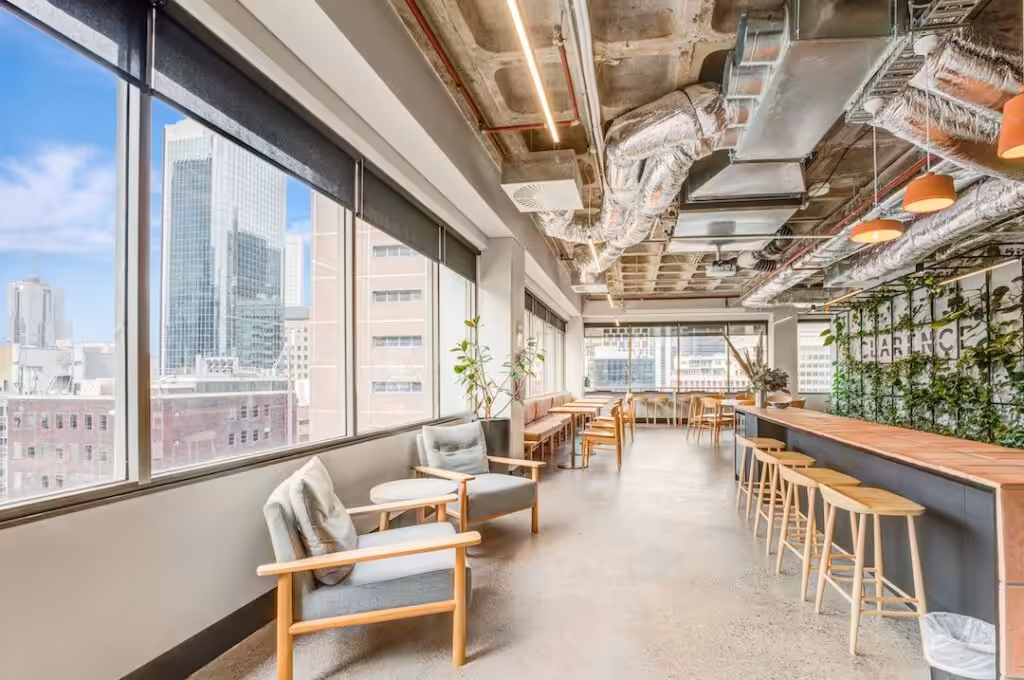The member lounge at Clarence, 456 Lonsdale Street, Melbourne, with armchairs along the windows and a bar-height bench