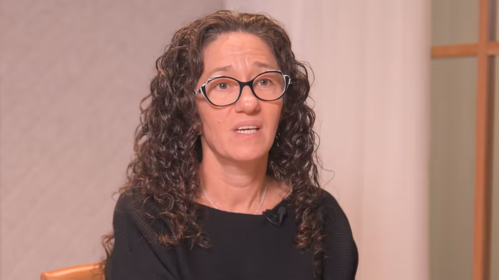 Helena Mrmos, Principal Lawyer at Mozaik Lawyers, smiling to camera in a still from her member story video