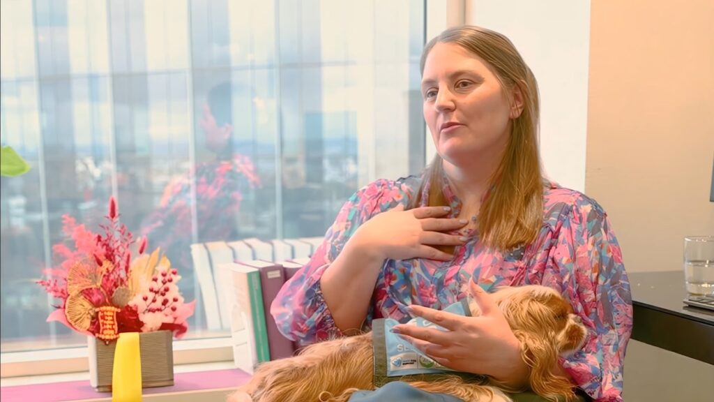 Laura Blandthorn, Principal Lawyer at Solidarity Solicitors, with her assistance dog in her Melbourne office