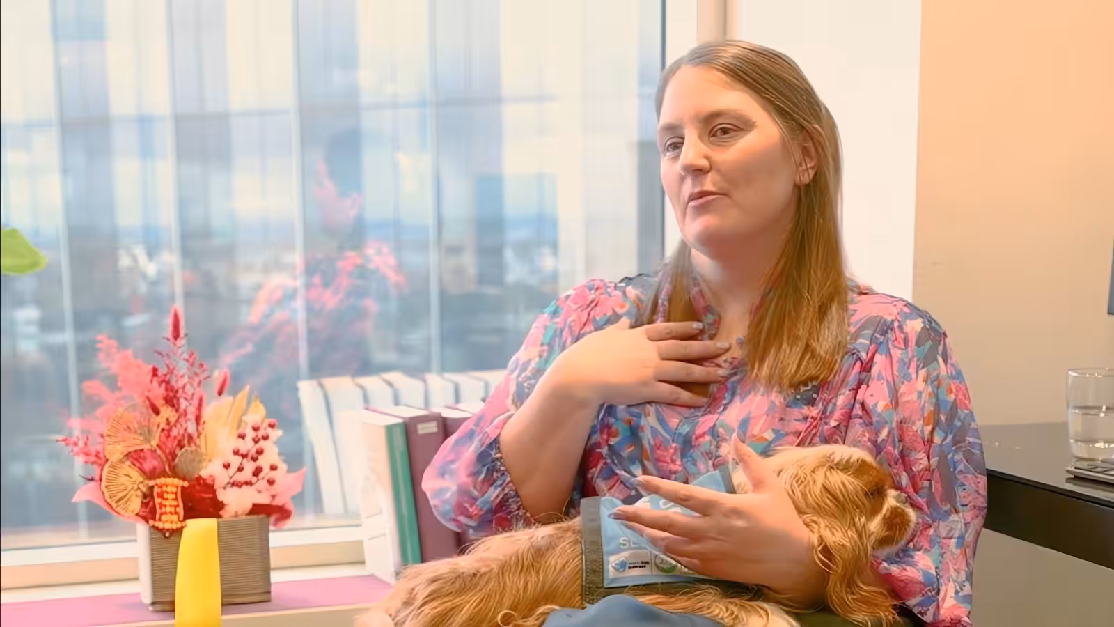 Laura Blandthorn, Principal Lawyer at Solidarity Solicitors, with her assistance dog in her Melbourne office